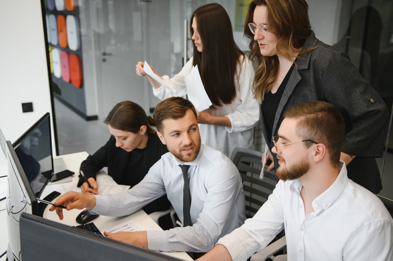 Business people working on project in office.