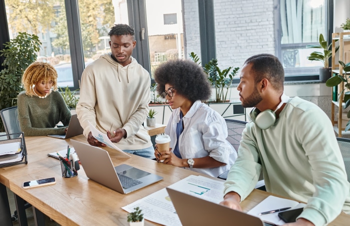 a group of people working in a cafe