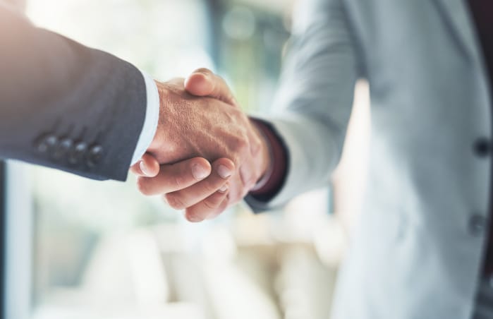 two people shaking hands